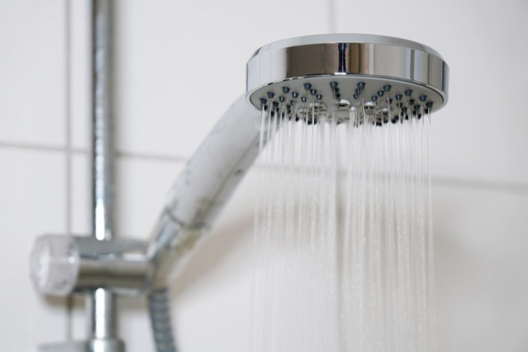 shower with modern showerhead and running water - Heat Pumps -Heat Pumps Tapping