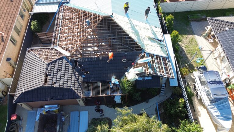 Roof plumbers working on residential roof repair 