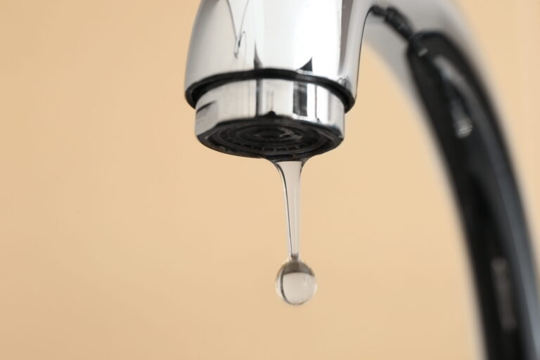Leak Repair  Water Droplet Falling from Leaking Tap Close Up