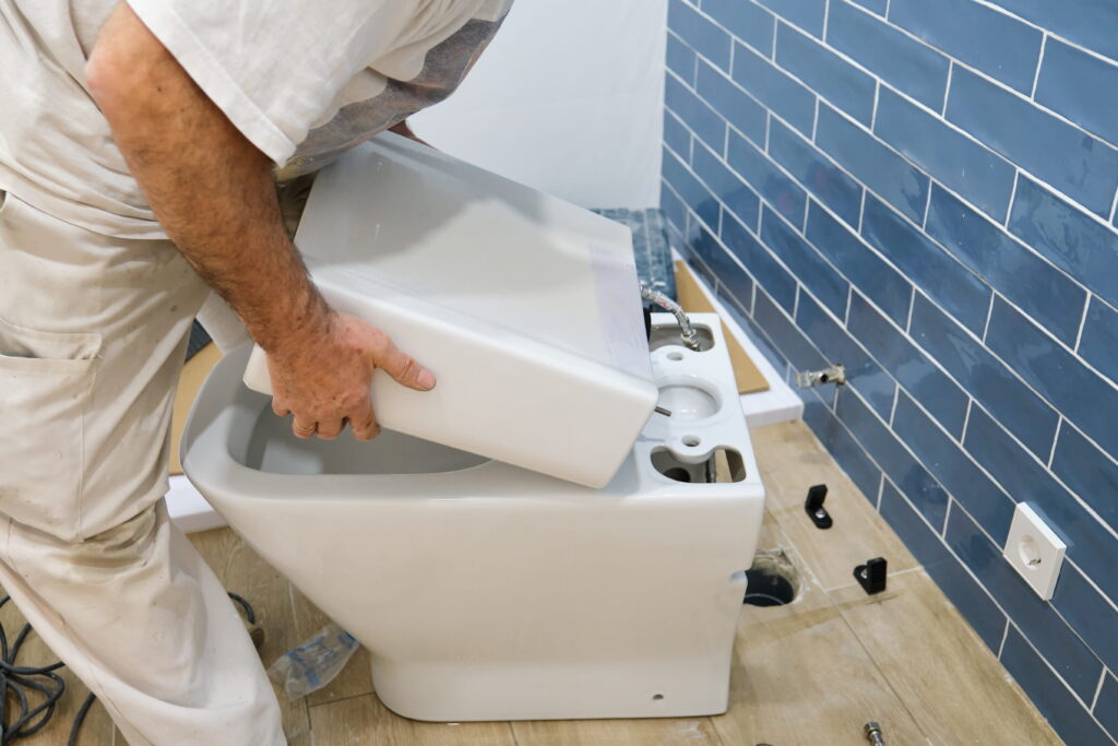 Toilet Replacement  plumber installing new toilet in bathroom renovation-Toilet Replacement Ashfield