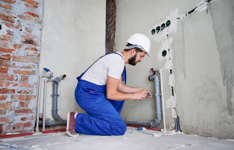 Perth emergency plumber working on a water pipe in a perth home